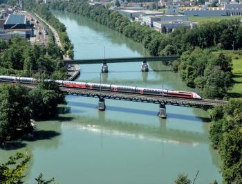 tgv lyria train above a river