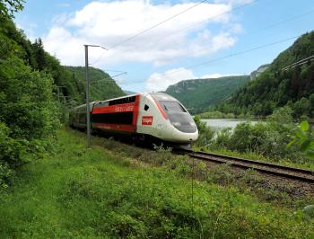 tgv lyria train running in the nature in summer