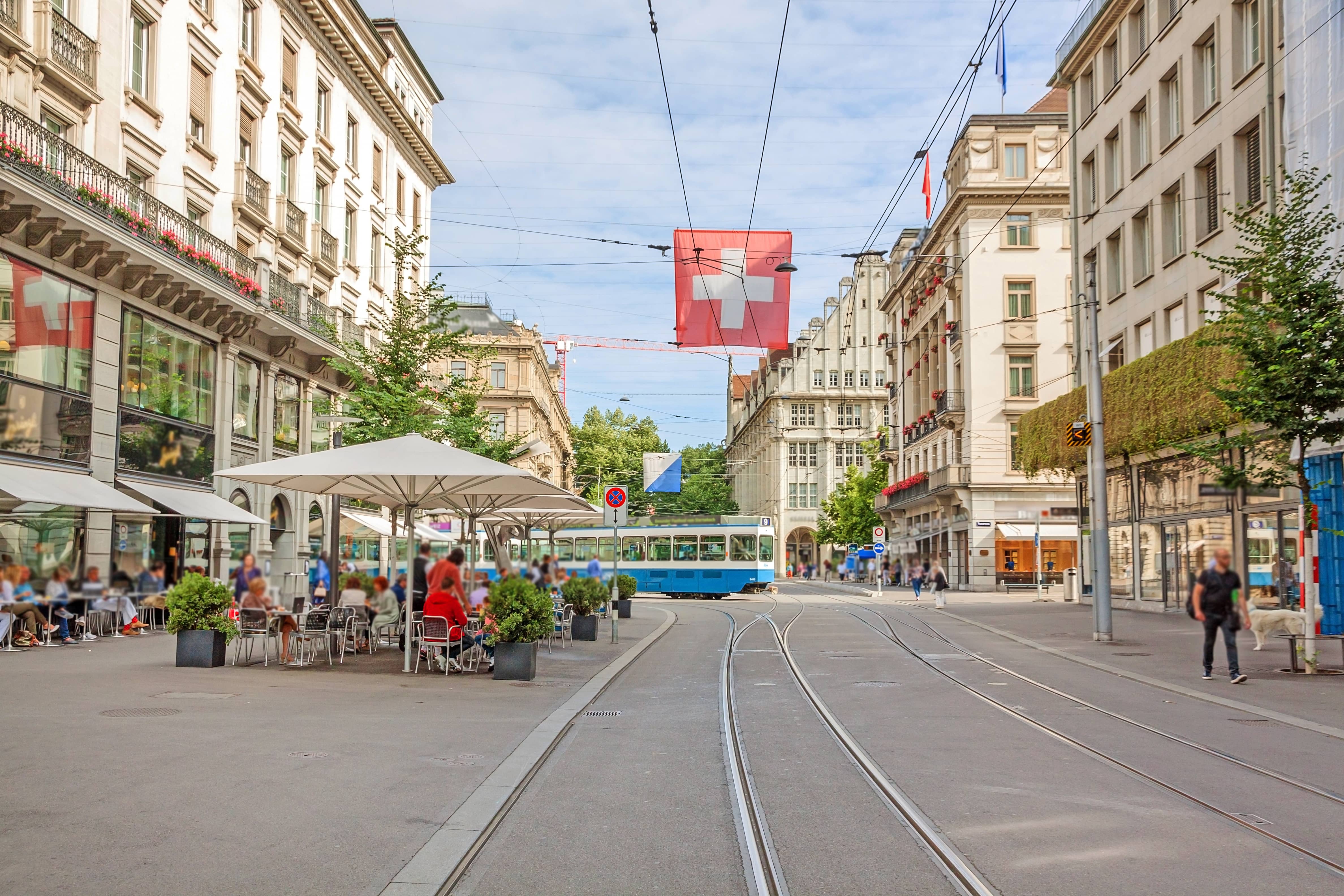 tgv lyria zurich shopping street tram and swiss flag