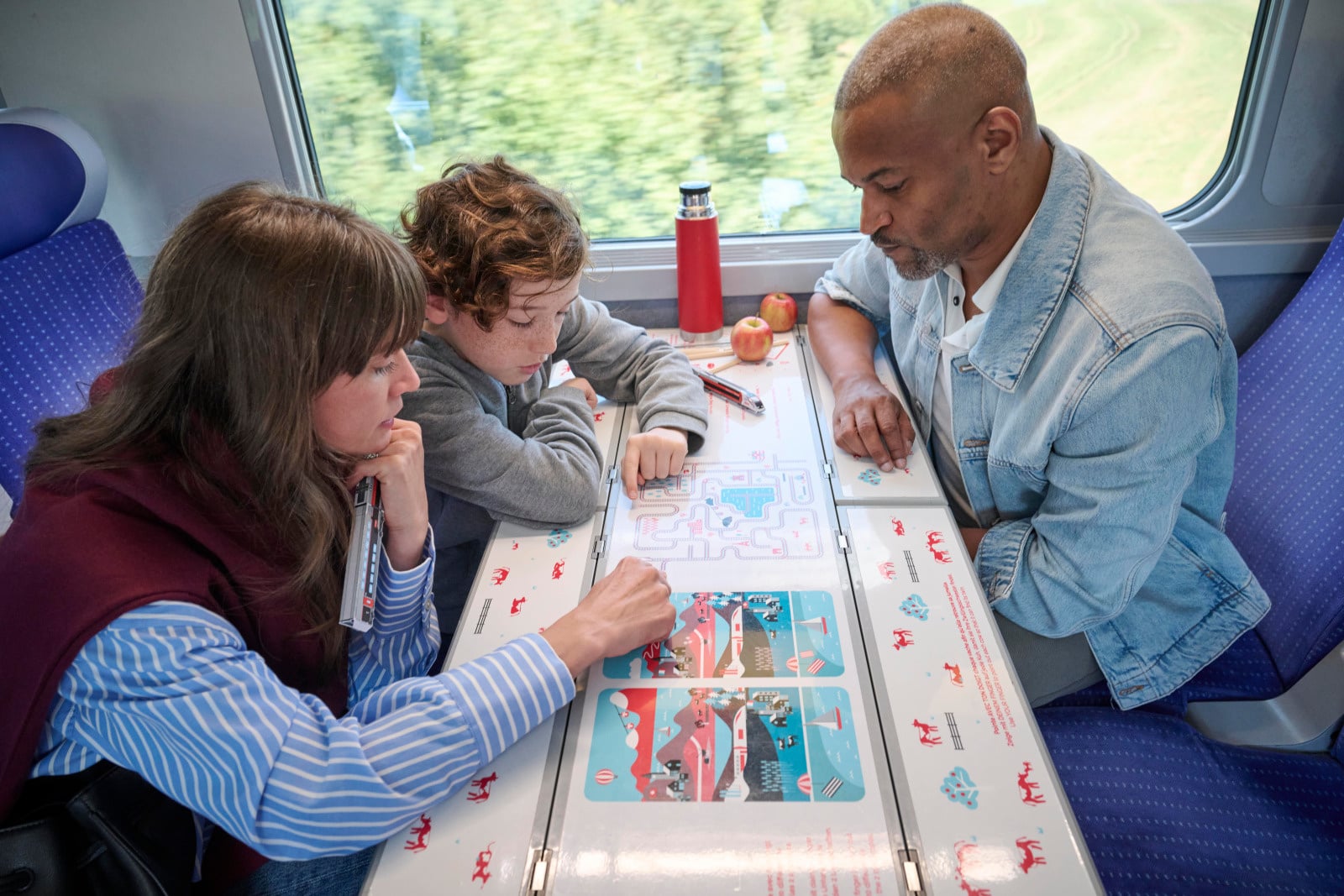 Famille à bord de TGV Lyria