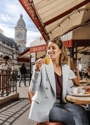 tgv lyria woman on the terrace in front of the station