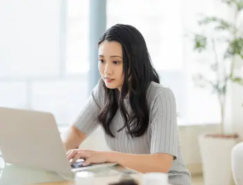 tgv lyria woman with a computer booking train