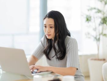 tgv lyria woman with a computer booking train