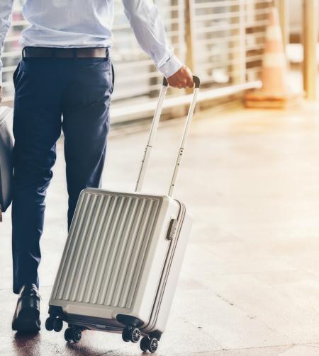 Traveller in the station with his suitcase