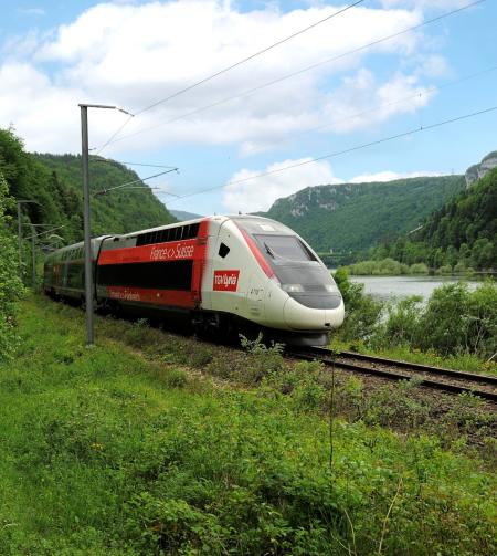 tgv lyria train running in the nature in summer