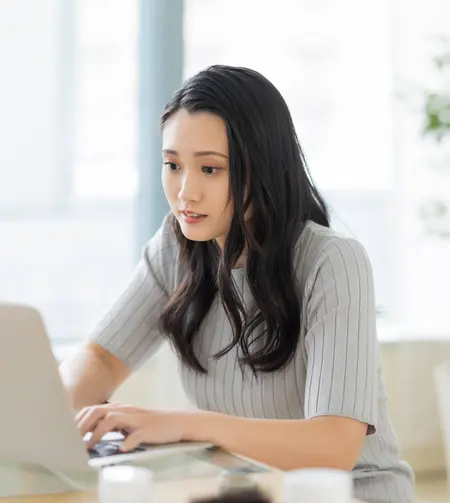 tgv lyria woman with a computer booking train