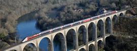 TGV Lyria - running train on a bridge